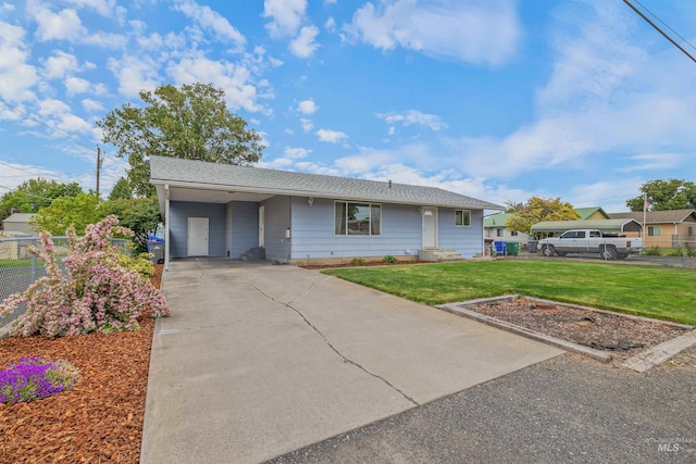 1125 Grelle Ave, Lewiston, ID 83501 - view of front facade featuring driveway, an attached carport, and a shingled roof