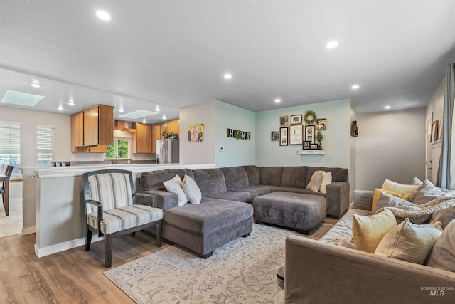 1125 Grelle Ave, Lewiston, ID 83501 - living area with recessed lighting, a skylight, wood finished floors, and baseboards