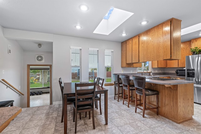 1125 Grelle Ave, Lewiston, ID 83501 - dining area with a skylight, recessed lighting, and baseboards
