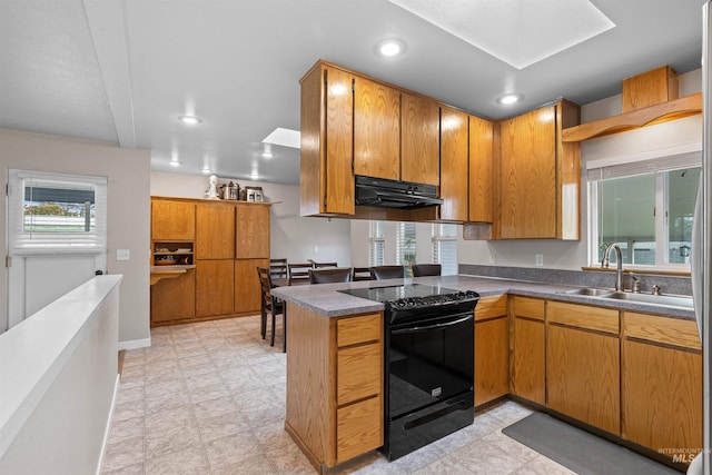 1125 Grelle Ave, Lewiston, ID 83501 - kitchen with black range with electric cooktop, under cabinet range hood, a sink, recessed lighting, and dark countertops