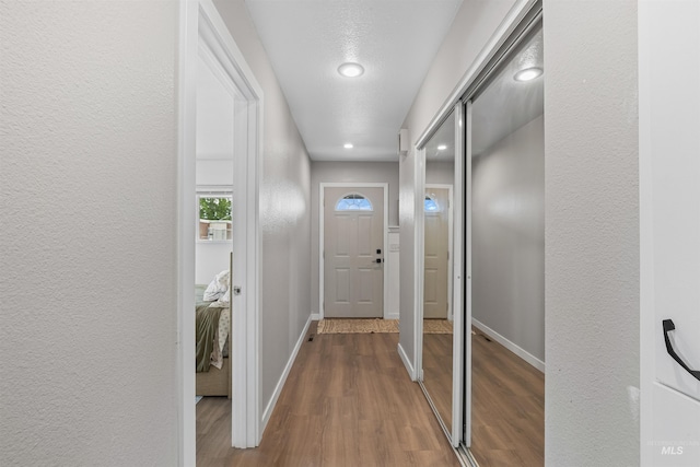 1125 Grelle Ave, Lewiston, ID 83501 - doorway with wood finished floors, recessed lighting, baseboards, and a textured wall