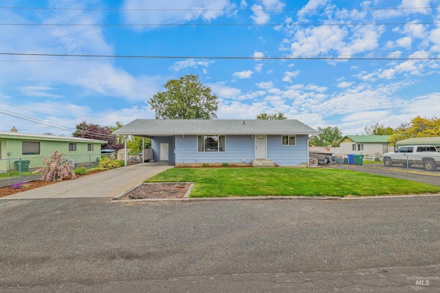 1125 Grelle Ave, Lewiston, ID 83501 - view of front facade featuring asphalt driveway, entry steps, and a carport