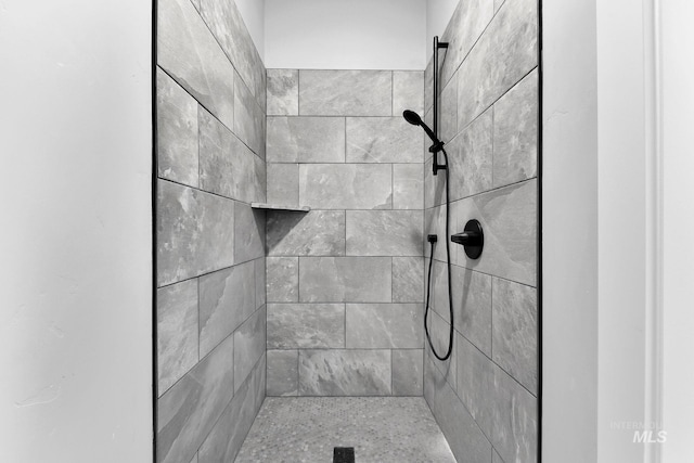 bathroom with tiled shower