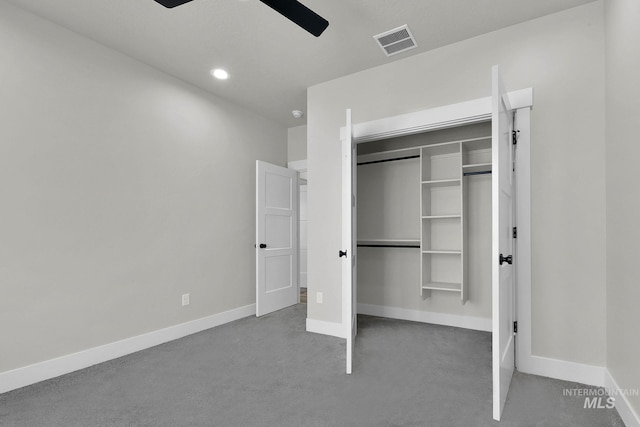 unfurnished bedroom with ceiling fan and a closet