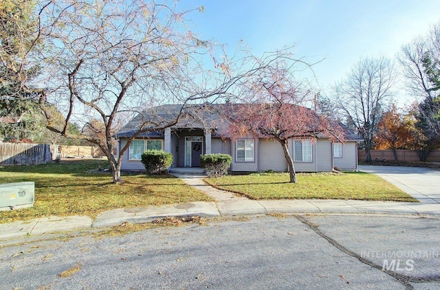 ranch-style house with a front lawn