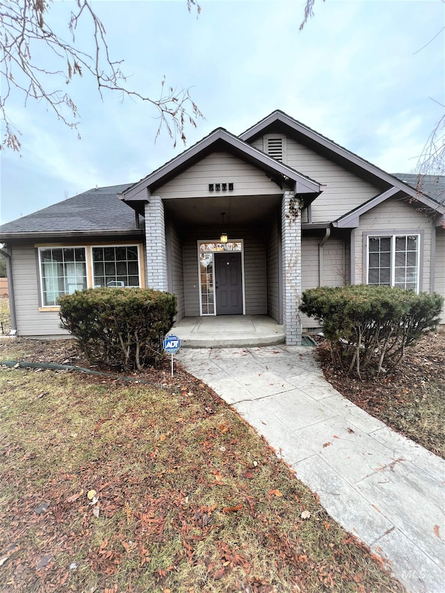 ranch-style home with covered porch