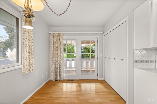 doorway to outside featuring light hardwood / wood-style floors