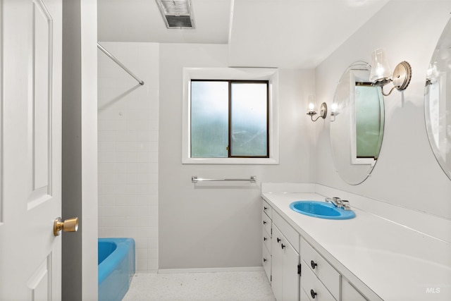 bathroom with vanity and washtub / shower combination