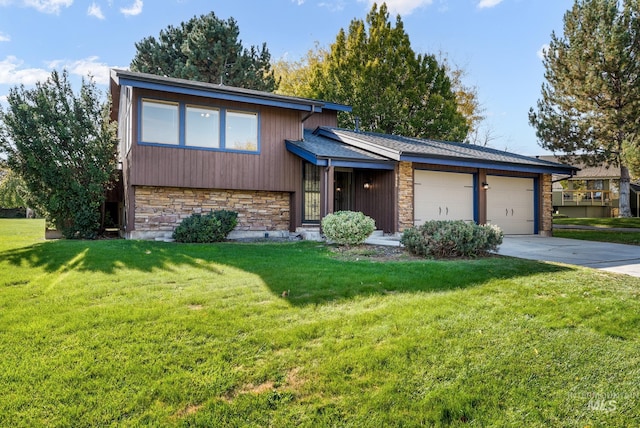 split level home with a garage and a front lawn