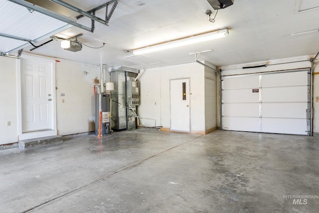 garage featuring a garage door opener and gas water heater