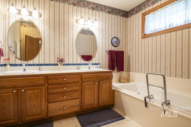 2555 E Quail Run Rd, Emmett, ID 83617 - full bathroom with a garden tub, double vanity, wallpapered walls, and tile patterned floors