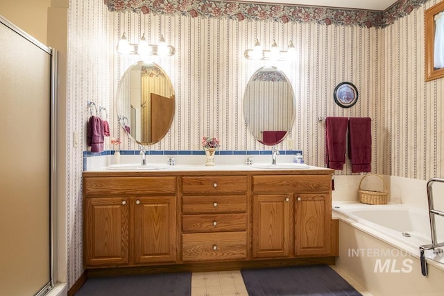 2555 E Quail Run Rd, Emmett, ID 83617 - bathroom with a shower stall, a garden tub, double vanity, and wallpapered walls