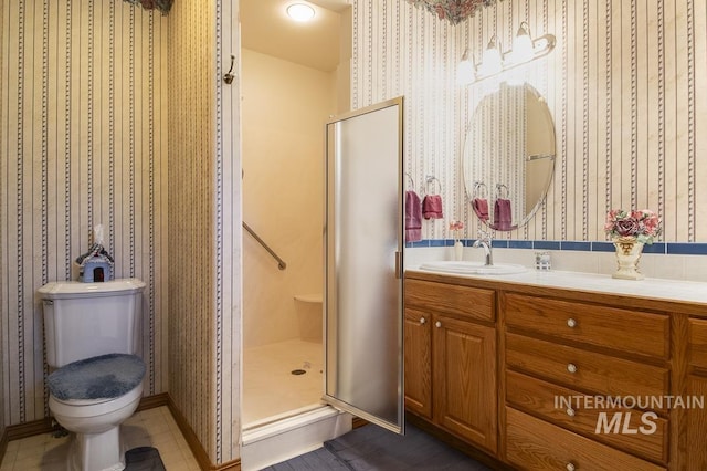 2555 E Quail Run Rd, Emmett, ID 83617 - full bath featuring wallpapered walls, vanity, a stall shower, toilet, and baseboards