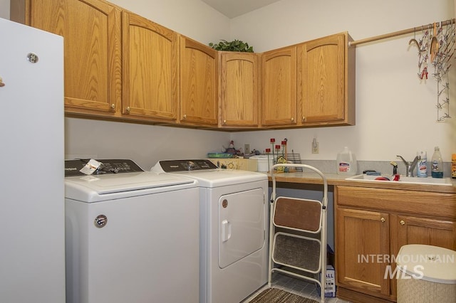 2555 E Quail Run Rd, Emmett, ID 83617 - laundry area with cabinet space and washing machine and clothes dryer