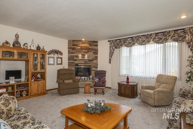 2555 E Quail Run Rd, Emmett, ID 83617 - living room featuring light colored carpet, a stone fireplace, and a textured ceiling