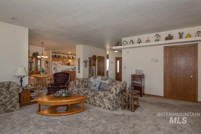 2555 E Quail Run Rd, Emmett, ID 83617 - carpeted living area with a chandelier and a textured ceiling