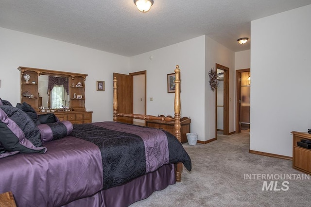 2555 E Quail Run Rd, Emmett, ID 83617 - carpeted bedroom with baseboards and a textured ceiling