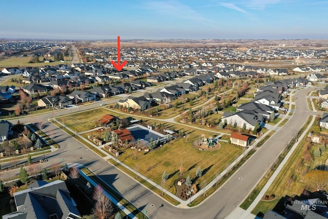 birds eye view of property with a residential view