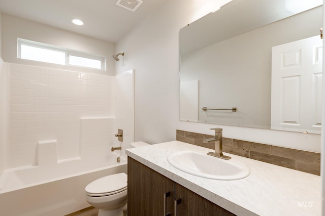 bathroom featuring toilet, recessed lighting, vanity, visible vents, and  shower combination