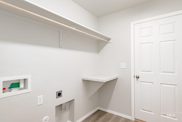 laundry area with hookup for a washing machine, laundry area, wood finished floors, baseboards, and electric dryer hookup