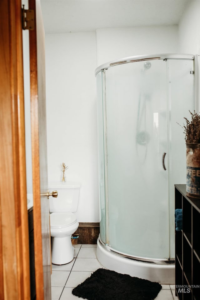 421 Hill St, Grangeville, ID 83530 - bathroom with tile patterned flooring, a shower stall, toilet, and vanity