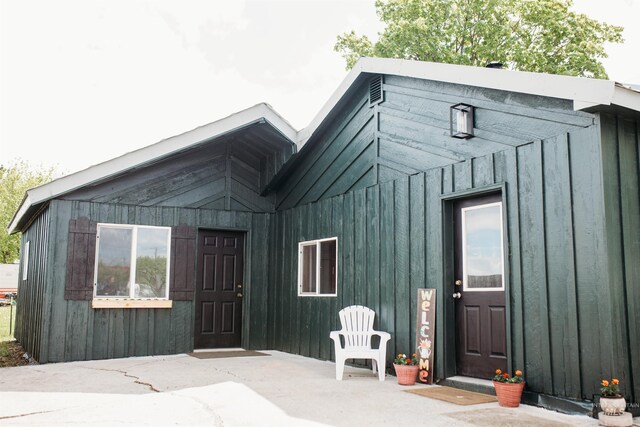 421 Hill St, Grangeville, ID 83530 - view of exterior entry featuring board and batten siding and a patio area
