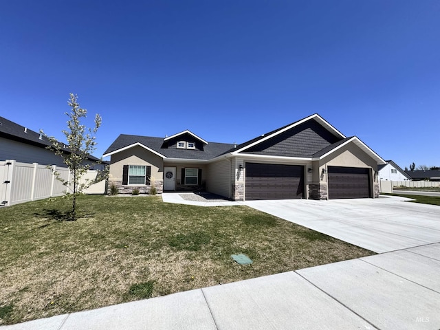 720 Shadowleaf Ave, Twin Falls, ID 83301 - view of front facade with stone siding, an attached garage, and driveway