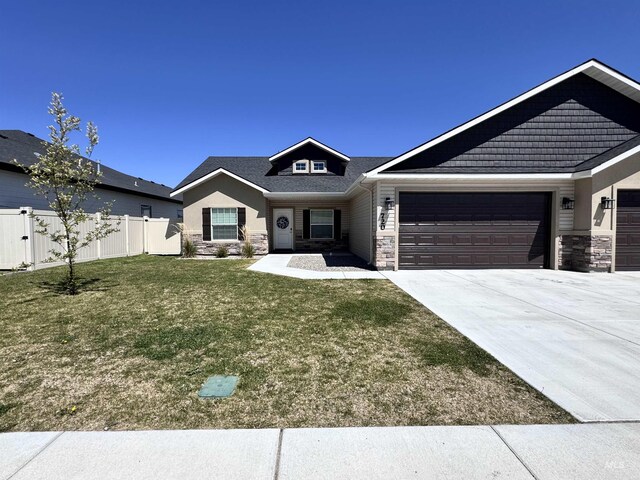 720 Shadowleaf Ave, Twin Falls, ID 83301 - craftsman house featuring stone siding, driveway, and an attached garage
