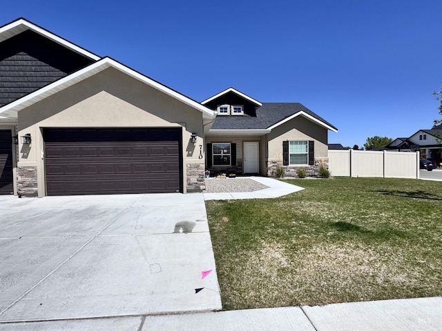 720 Shadowleaf Ave, Twin Falls, ID 83301 - view of front of house with stone siding, a garage, concrete driveway, and stucco siding
