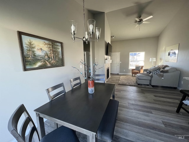 720 Shadowleaf Ave, Twin Falls, ID 83301 - dining space featuring wood finished floors, high vaulted ceiling, a chandelier, baseboards, and ceiling fan