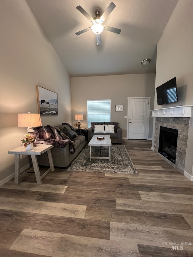 720 Shadowleaf Ave, Twin Falls, ID 83301 - living area featuring high vaulted ceiling, ceiling fan, a premium fireplace, wood finished floors, and baseboards