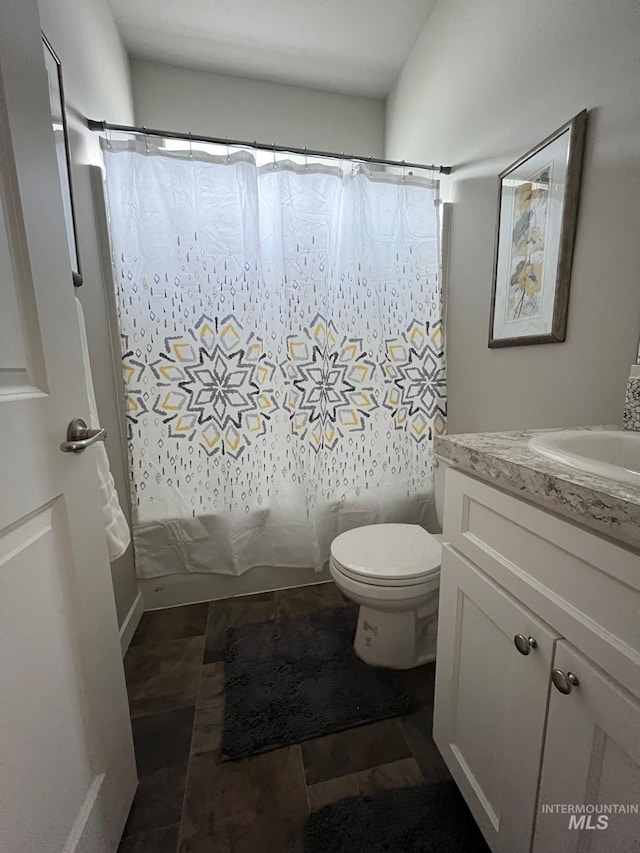 720 Shadowleaf Ave, Twin Falls, ID 83301 - bathroom featuring toilet, vanity, and shower / bath combo with shower curtain