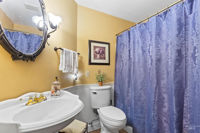 bathroom with toilet and sink