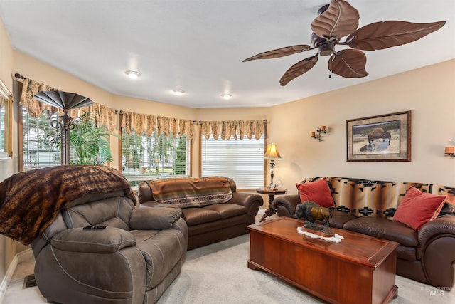 living room featuring light carpet and ceiling fan