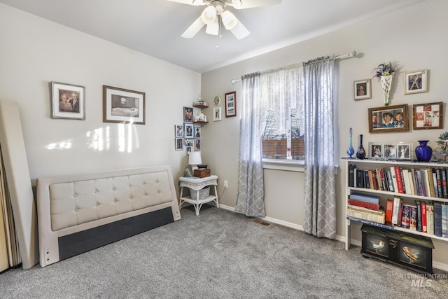 interior space featuring carpet floors and ceiling fan