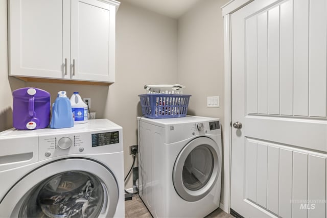 laundry area featuring cabinets and independent washer and dryer