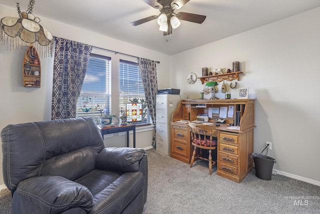 carpeted office featuring ceiling fan