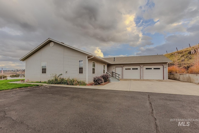 ranch-style home featuring a garage