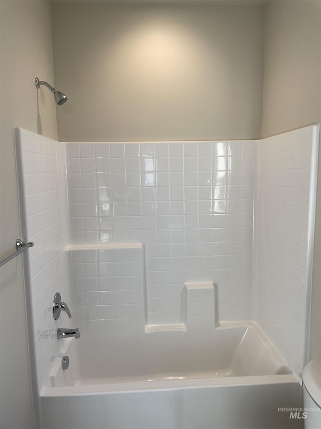 full bathroom with toilet and washtub / shower combination