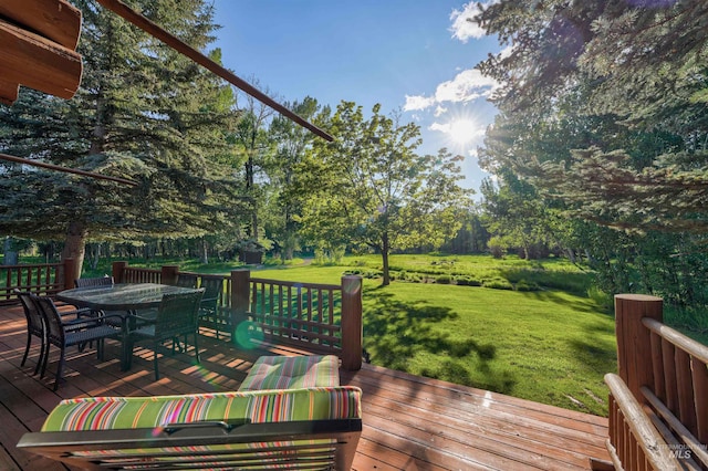 1301 Glen Aspen Dr, Bellevue, ID 83313 - wooden deck featuring a yard, outdoor dining space, and view of scattered trees