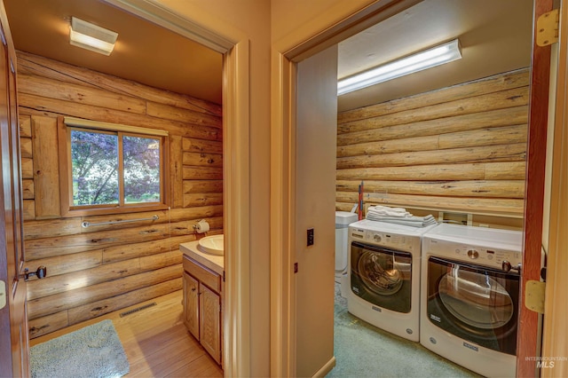 1301 Glen Aspen Dr, Bellevue, ID 83313 - laundry area with washing machine and clothes dryer and rustic walls