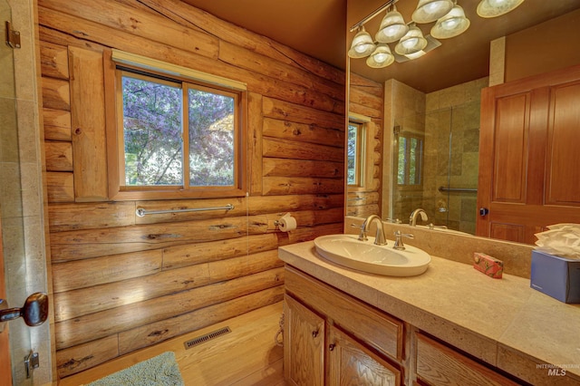 1301 Glen Aspen Dr, Bellevue, ID 83313 - full bath featuring log walls, vanity, and a stall shower