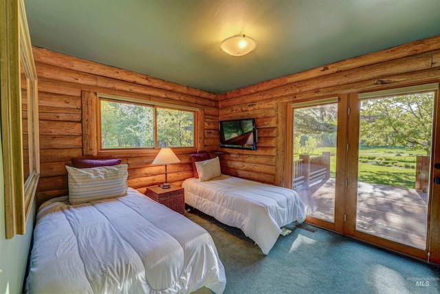 1301 Glen Aspen Dr, Bellevue, ID 83313 - bedroom featuring access to outside, multiple windows, carpet flooring, and rustic walls