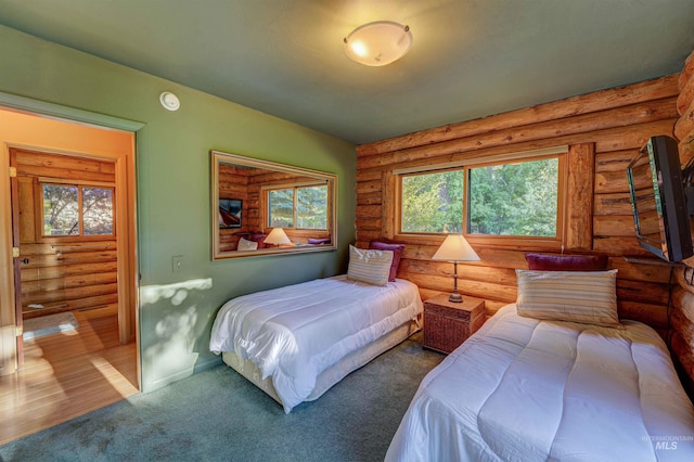 1301 Glen Aspen Dr, Bellevue, ID 83313 - carpeted bedroom featuring log walls