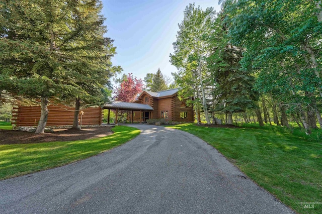 1301 Glen Aspen Dr, Bellevue, ID 83313 - log cabin featuring log siding, a front lawn, driveway, and metal roof