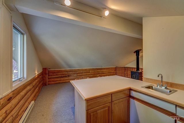 1301 Glen Aspen Dr, Bellevue, ID 83313 - kitchen featuring a sink, light carpet, baseboard heating, a peninsula, and light countertops