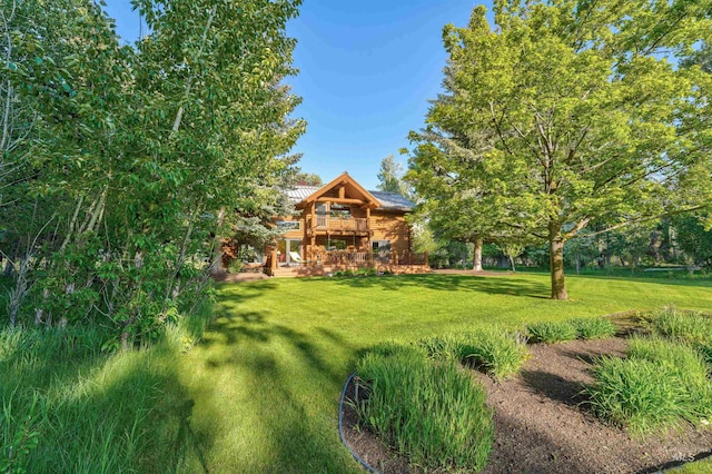 1301 Glen Aspen Dr, Bellevue, ID 83313 - view of grassy yard with a wooden deck