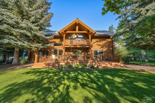 1301 Glen Aspen Dr, Bellevue, ID 83313 - back of property featuring a balcony, log siding, a yard, and a wooden deck