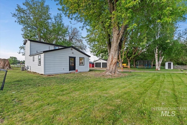 5009 Airport Rd, Nampa, ID 83687 - back of house featuring a lawn and central AC unit