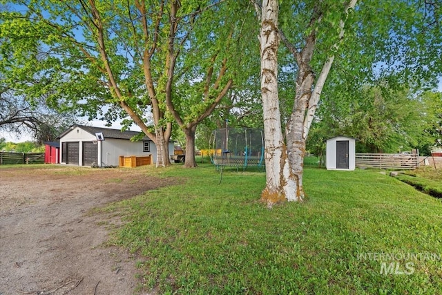 5009 Airport Rd, Nampa, ID 83687 - view of yard with a trampoline and driveway